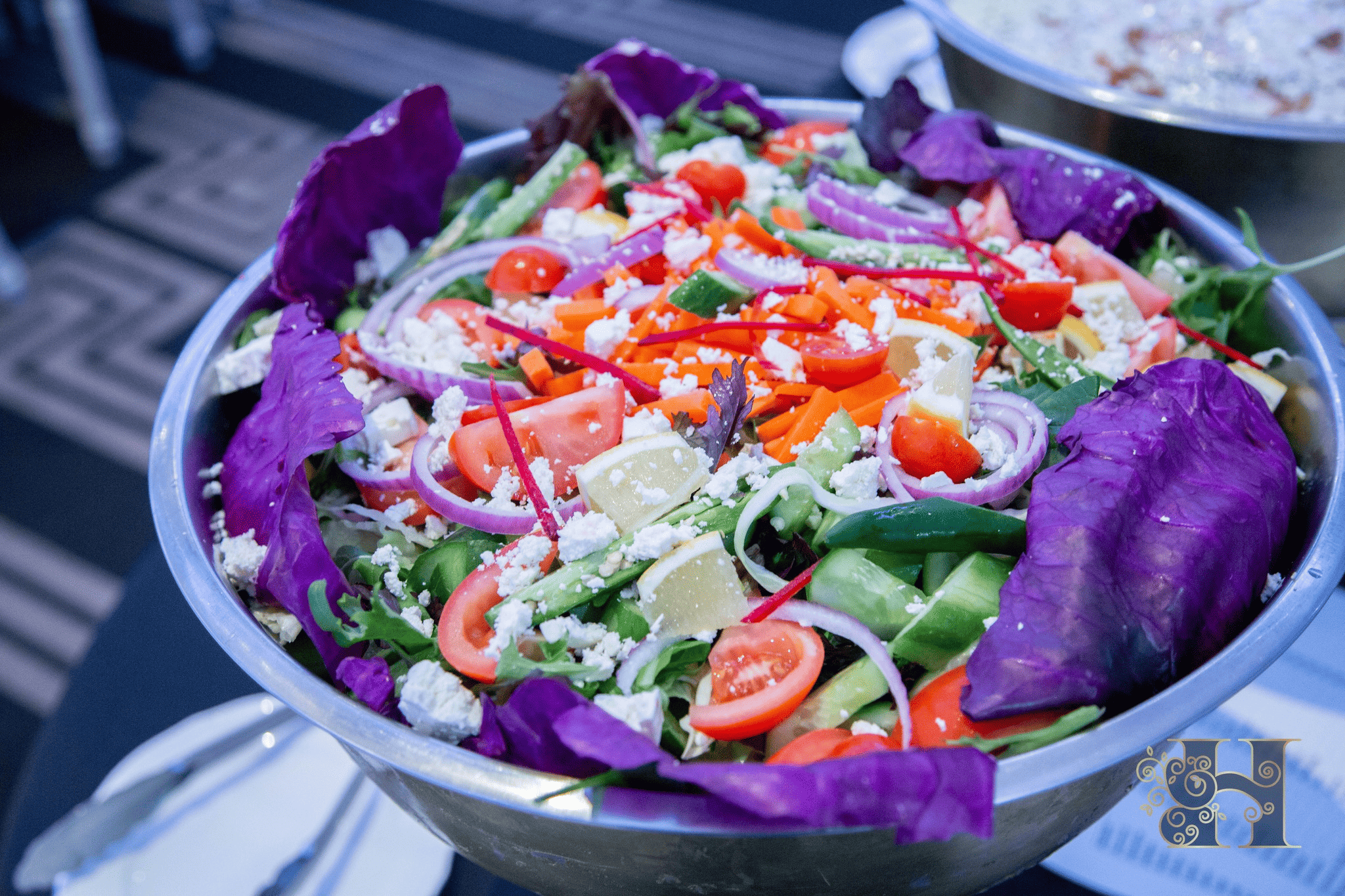 Fresh and colorful homemade salad with a mix of vibrant vegetables, greens, and toppings.